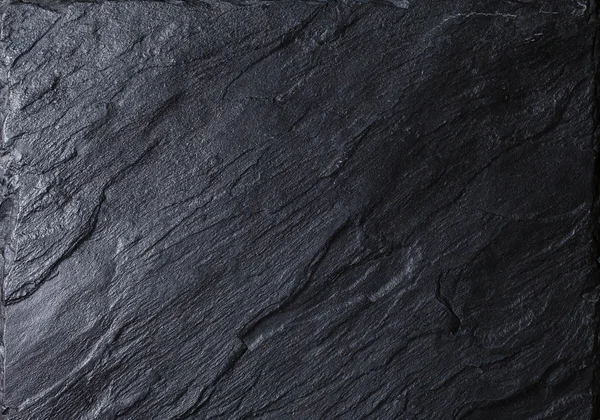 Черная каменная структура — стоковое фото